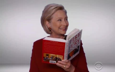 HIllary Clinton with Michael Wolff's first Trump book, Fire and Fury - Credit: &nbsp;BACKGRID/&nbsp;NIPI