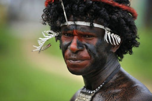 A Papuan tribesman participates in the Lake Sentani festival in the Jayapura district of the eastern Indonesian province of Papua. The island of New Guinea that encompasses Papua New Guinea and Indonesian Papua is a vast reservoir of languages in a world where languages of various tribal groups are disappearing quietly, according to anthropologists