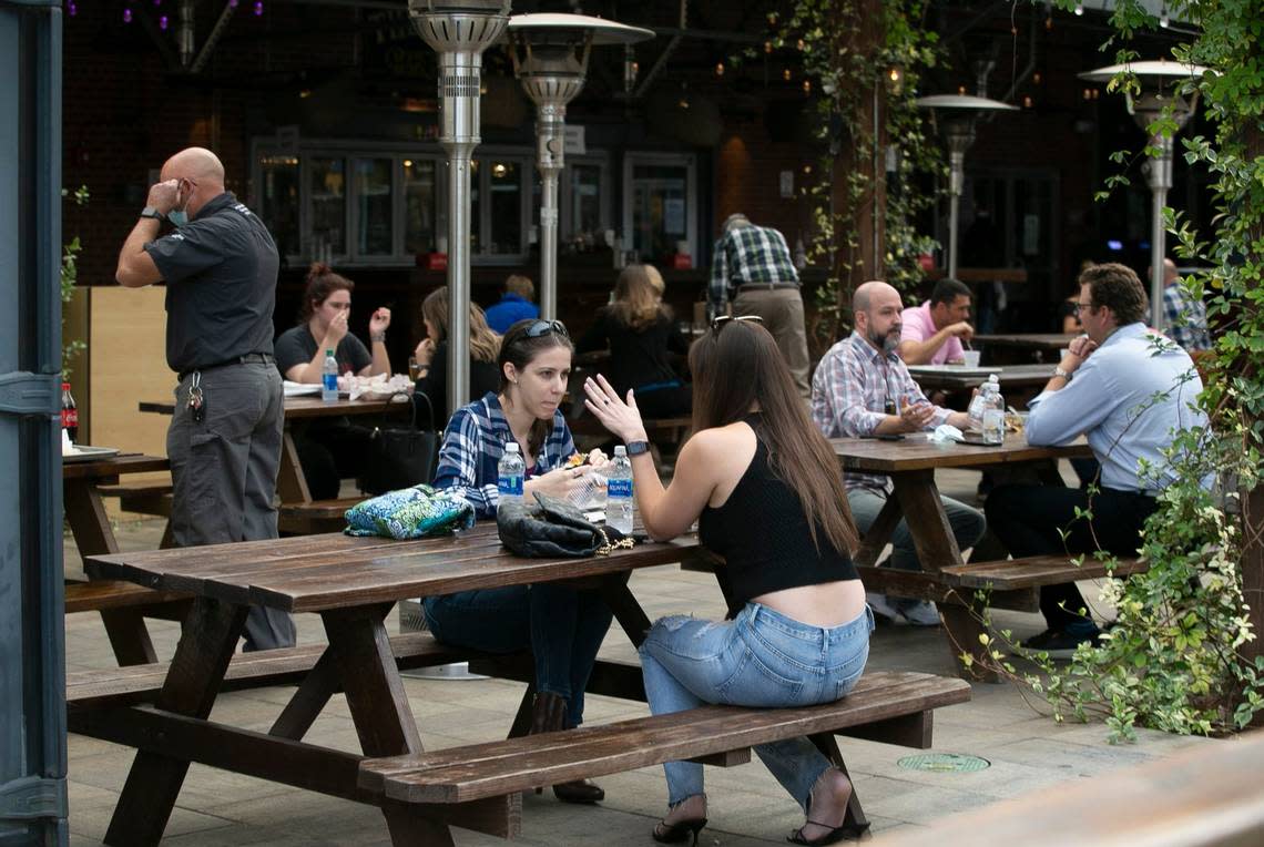 Patrons dine outside at the Morgan Street Food Hall on West Street during the lunch hour on Friday, October 9, 2020 in Raleigh, N.C.