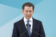 Former Austrian Chancellor Sebastian Kurz announces that he is quitting politics, two months after stepping down as leader amid corruption allegations, during a news conference in Vienna, Austria, Thursday, Dec. 2, 2021. (AP Photo/Lisa Leutner)