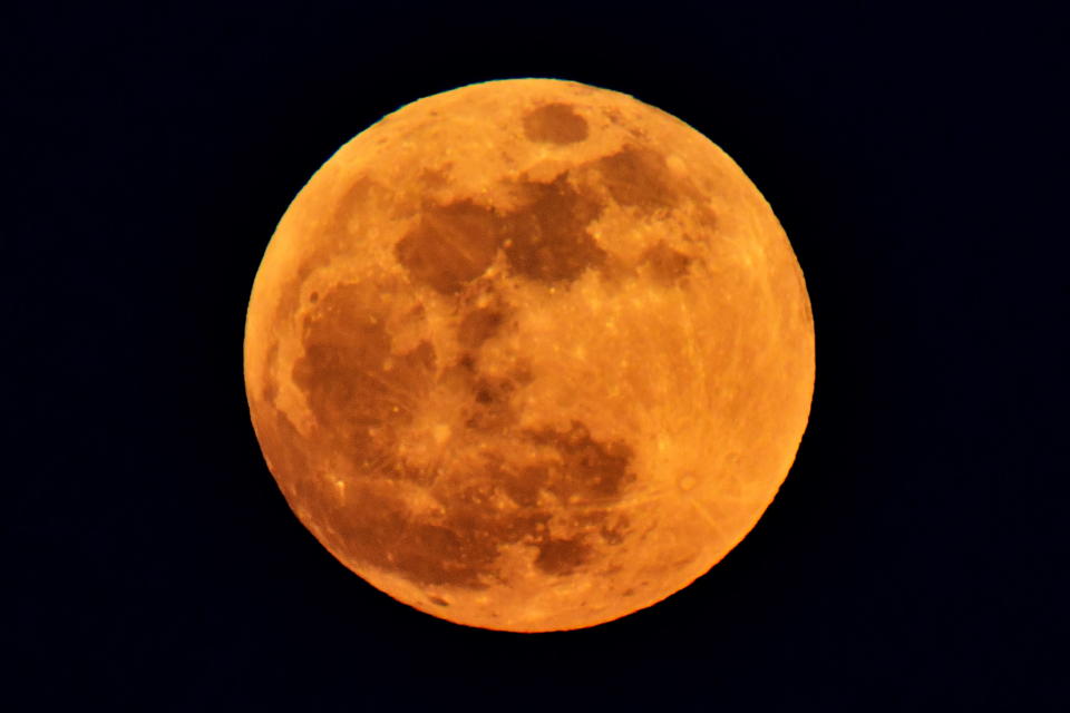 <p>A red supermoon rises over hills in the city of Vladivostok in Russia’s Far East on Jan. 31, 2018. (Photo: Yuri Smityuk\TASS via Getty Images) </p>