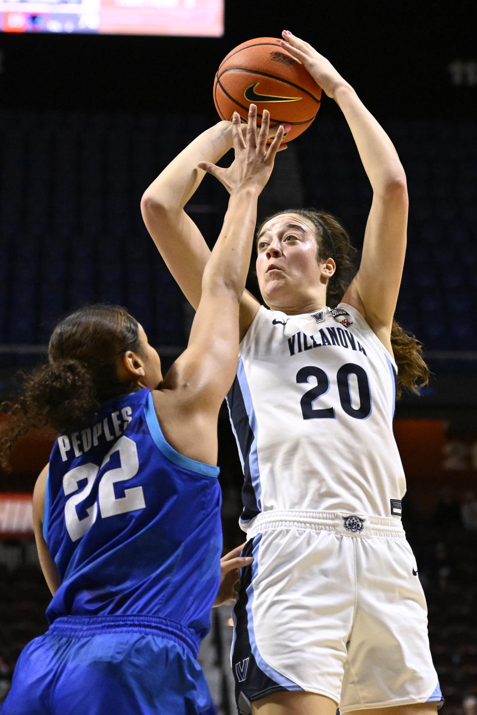 FILE - Villanova's Maddy Siegrist (20) shoots over DePaul's Anaya Peoples (22) during the second half of an NCAA college basketball game in the quarterfinals of the Big East Conference tournament at Mohegan Sun Arena, Saturday, March 4, 2023, in Uncasville, Conn. Siegrist was honored as an All-American by The Associated Press on Wednesday, March 15, 2023. (AP Photo/Jessica Hill, File)
