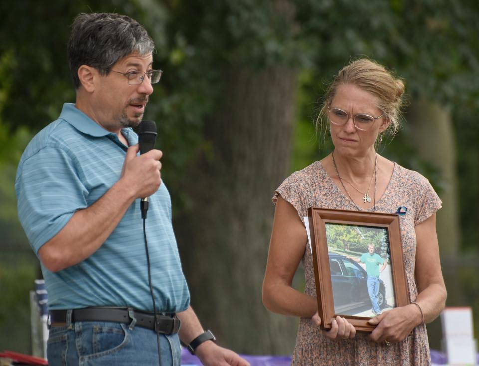 George and Vicki Ghareeb of Temperance talk about their son, Christopher, at the 18th annual Suicide Awareness, Prevention and Remembrance Vigil and Gathering Thursday in the pavilion at St. Mary's Park in Monroe. Christopher took his own life at the age of 17.