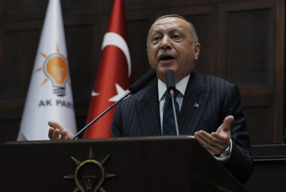 Turkey's President Recep Tayyip Erdogan addresses his ruling party MPs, in Ankara, Turkey, Tuesday, June 25, 2019, two days after Ekrem Imamoglu, the candidate of the secular opposition Republican People's Party, won the election for mayor of Istanbul. Erdogan addressed his AK Party's weekly meeting, the first time he speaks since the Istanbul mayoral election Sunday, which was a big setback for him and his party.(AP Photo/Burhan Ozbilici)