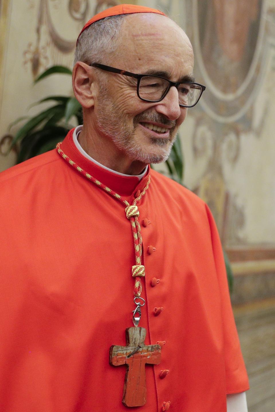 Cardinal Michael Czerny poses for photographers prior to meeting relatives and friends after he was elevated to cardinal by Pope Francis, at the Vatican, Saturday, Oct. 5, 2019. Pope Francis has chosen 13 men he admires and whose sympathies align with his to become the Catholic Church's newest cardinals. (AP Photo/Andrew Medichini)