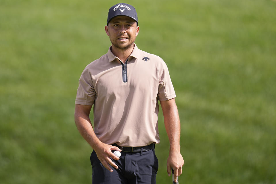 Xander Schauffele walks off the 17th green during the third round of the Memorial golf tournament Saturday, June 8, 2024, in Dublin, Ohio. (AP Photo/Sue Ogrocki)