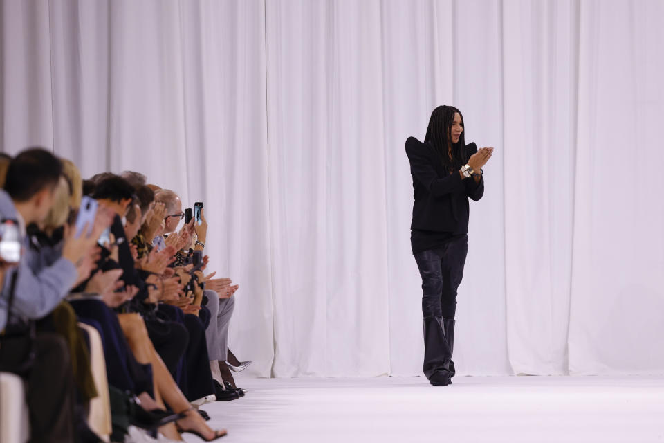 Designer Olivier Rousteing accepts applause after the Balmain Spring/Summer 2025 collection presented Wednesday, Sept. 25, 2024, in Paris. (Photo by Vianney Le Caer/Invision/AP)