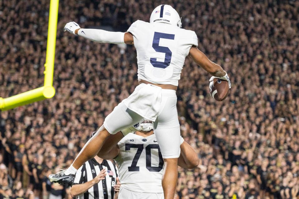 Penn State wide receiver Mitchell Tinsley (5) celebrates his touchdown in the second quarter against Purdue Boilermakers at Ross-Ade Stadium on Thursday night.