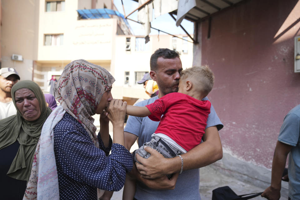 Palestinian parents say goodbye to their sick son before leaving the Gaza Strip to get treatment abroad through the Kerem Shalom crossing, in Khan Younis, southern Gaza Strip, Thursday, June 27, 2024. Twenty one patients in the Gaza Strip evacuated the war-torn enclave in an initiative led by the World Health Organization for the children to receive life-saving treatment elsewhere. (AP Photo/Abdel Kareem Hana)