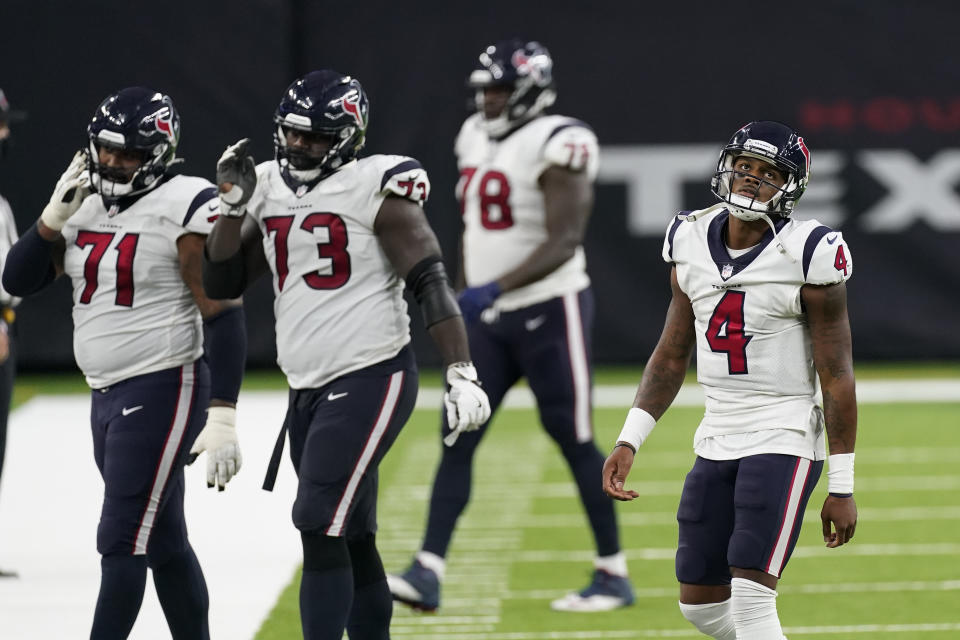 Houston Texans quarterback Deshaun Watson (4) walks off the field with teammates during the second half of an NFL football game against the Baltimore Ravens, Sunday, Sept. 20, 2020, in Houston. Baltimore won 33-16. (AP Photo/David J. Phillip)