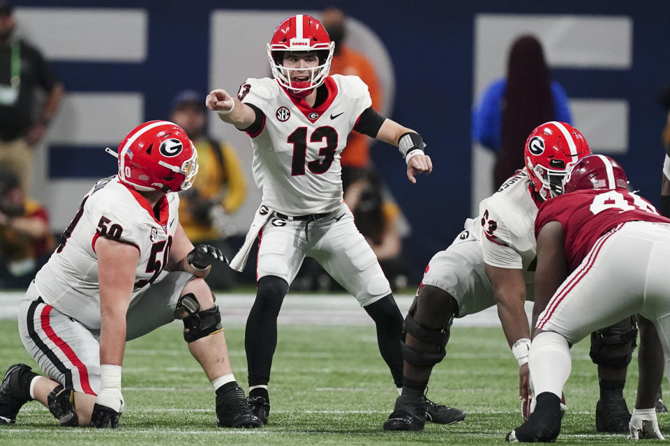 Georgia quarterback Stetson Bennett (13) calls audible against Alabama during the first half of the Southeastern Conference championship NCAA college football game, Saturday, Dec. 4, 2021, in Atlanta. (AP Photo/John Bazemore)