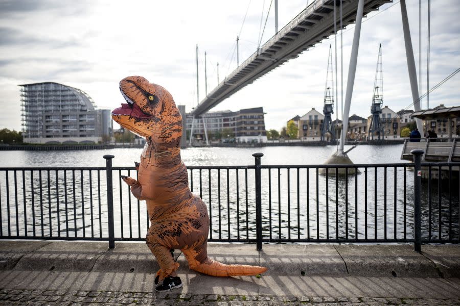 A cosplayer dressed as a dinosaur attends the MCM Comic Con at ExCeL exhibition centre in London on Oct. 28, 2017. (Photo/Tolga Akmen/AFP via Getty Images)