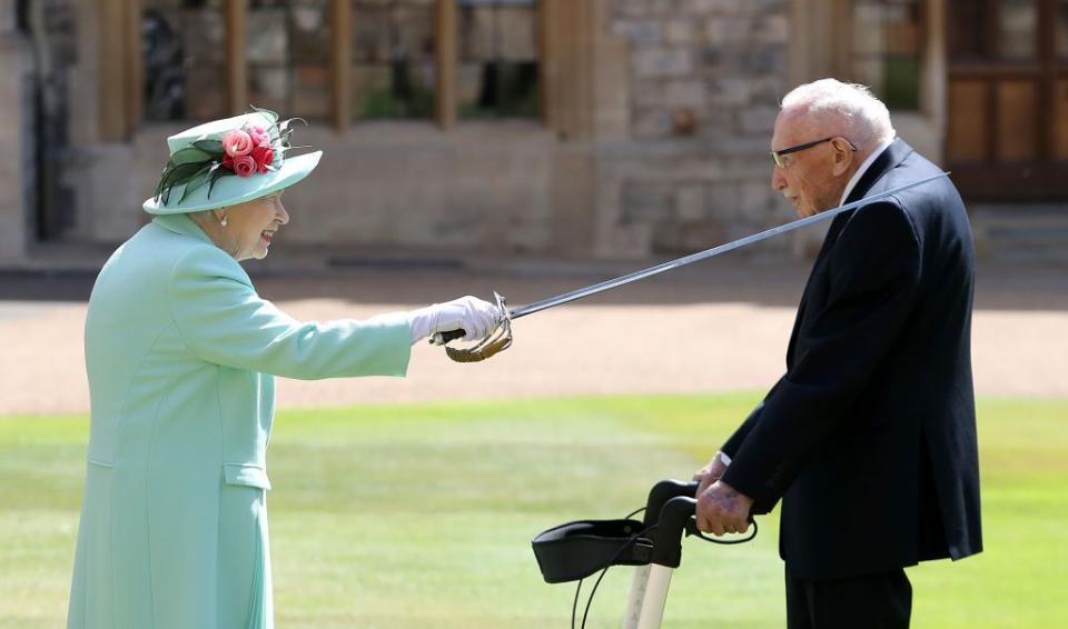 the queen confers the honour of knighthood on captain sir thomas moore