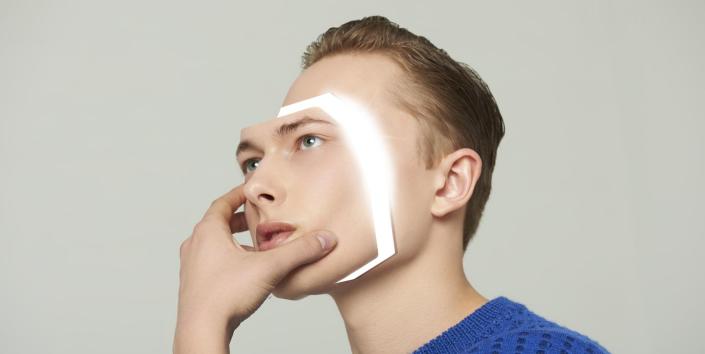android man removing his face