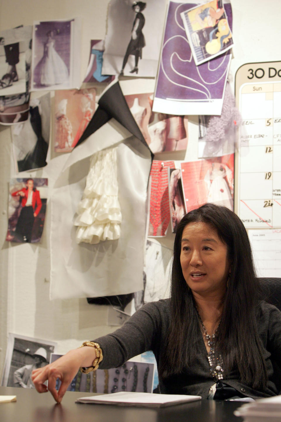 FILE - This June 14, 2005 file photo shows fashion designer Vera Wang gestures during an interview in her studio in New York. Wang, 63, was honored for her lifetime achievement by the Council of Fashion Designers at its star-studded awards show Monday night. She received the award from her former employer and mentor Ralph Lauren, and she received a standing ovation from her peers. (AP Photo/Mary Altaffer, file)