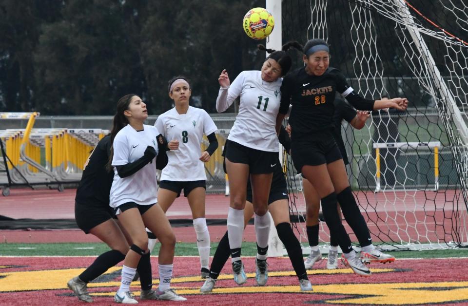 Pacifica's Nieto Anahi (No. 11) and Oxnard's Sienna Pimental both go for a header during the teams' 0-0 draw in a Channel League match on Saturday, Jan. 20, 2024.