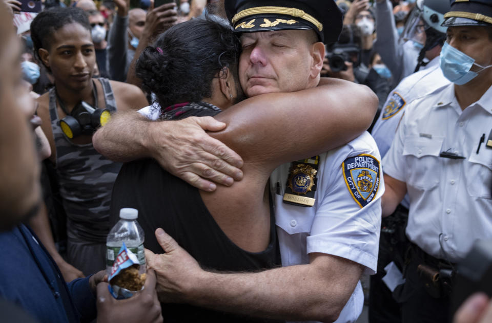 Chief of Department of the New York City Police, Terence Monahan, hugs an activist as protesters paused while walking in New York, Monday, June 1, 2020. Demonstrators took to the streets of New York to protest the death of George Floyd, who died May 25 after he was pinned at the neck by a Minneapolis police officer. (AP Photo/Craig Ruttle)