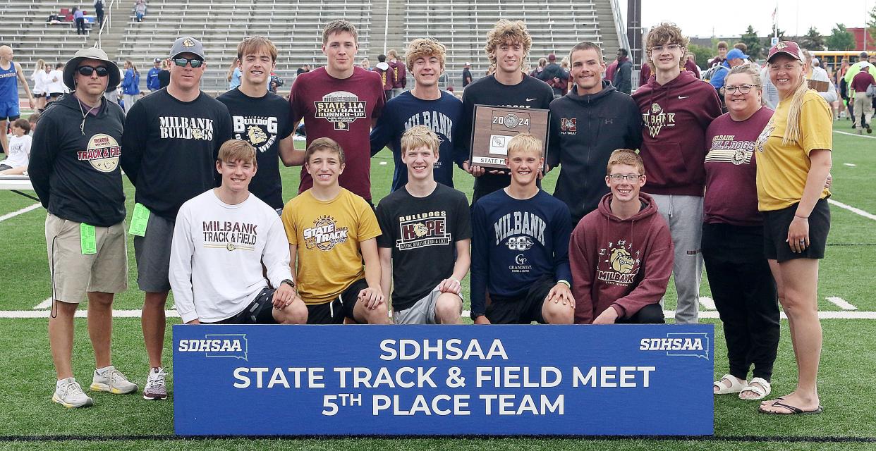 Head coach Eric Townsend, back left, is pictured with fellow coaches and athletes on the Milbank boys' track and field team that finished fifth in Class A during the 2024 South Dakota State Track and Field Championships in Sioux Falls. Townsend has been named the Area 1 Coach of the Year by the South Dakota Cross Country and Track and Field Coaches Association (SDCCTFCA).