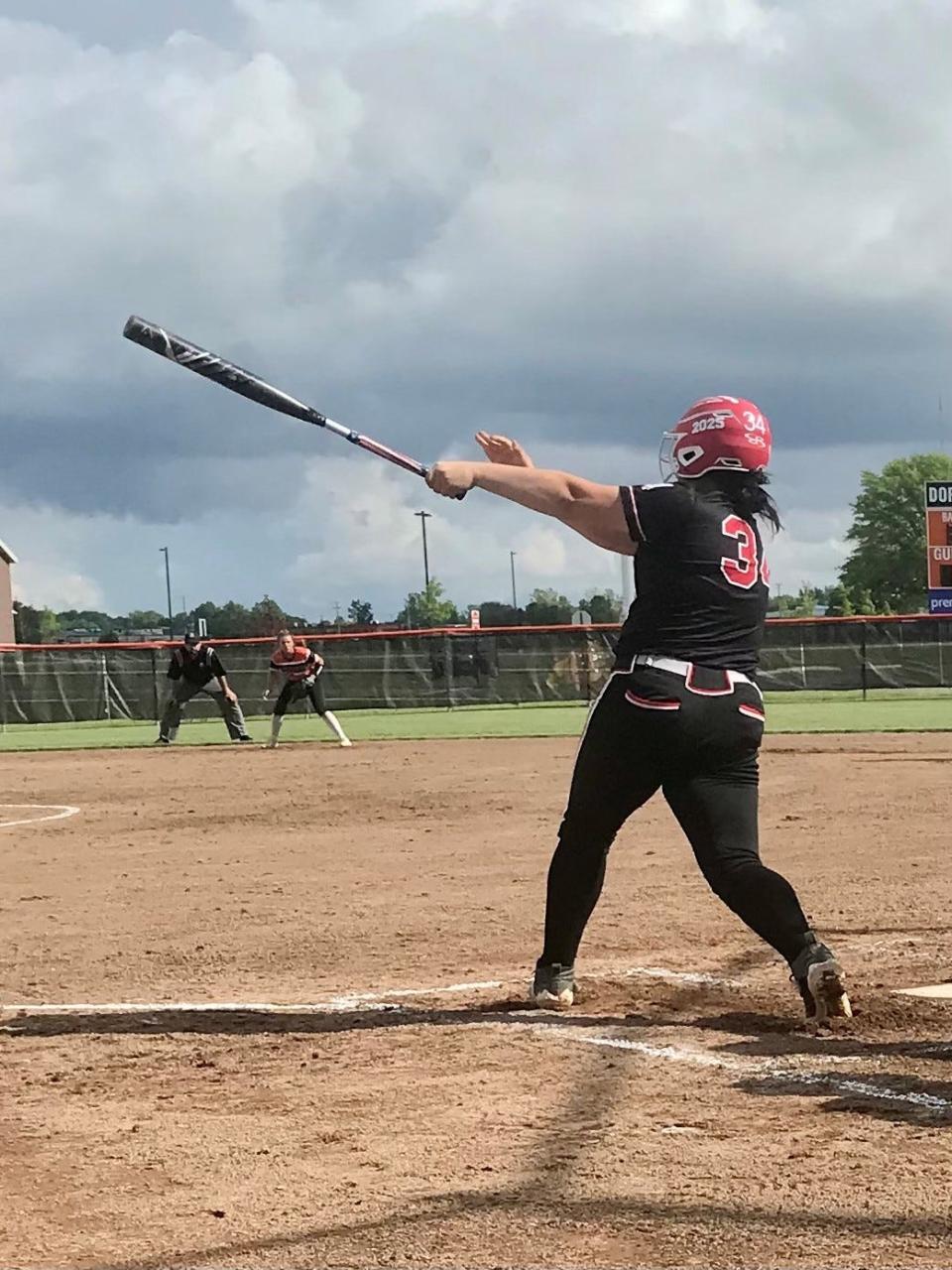 Cardington's Ari Simpson hits a single against Van Buren during Friday's Division III regional championship softball game at Elida.