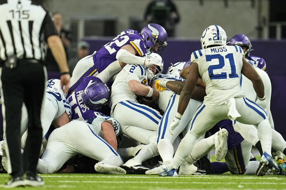 Indianapolis Colts quarterback Matt Ryan (2) is stopped on a fourth down run during the second half of an NFL football game against the Minnesota Vikings, Saturday, Dec. 17, 2022, in Minneapolis. (AP Photo/Abbie Parr)