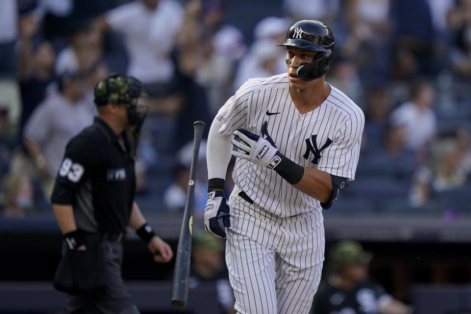 New York Yankees' Aaron Judge hits a game-tying home run off Chicago White Sox relief pitcher Kendall Graveman in the eighth inning of a baseball game, Sunday, May 22, 2022, in New York. (AP Photo/John Minchillo)