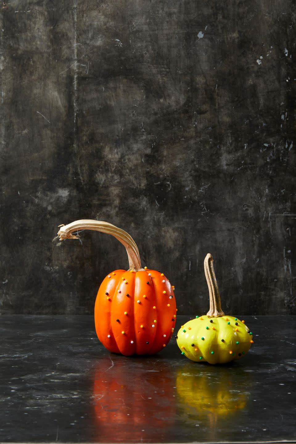 <p>Put old office supplies to clever use with these map tack pumpkins. Simply paint a pumpkin a solid color and let it dry completely, then pin map tacks all over the pumpkin's surface.</p><p><a class="link " href="https://www.amazon.com/gp/product/B01MXSJVM0/?tag=syn-yahoo-20&ascsubtag=%5Bartid%7C10055.g.1714%5Bsrc%7Cyahoo-us" rel="nofollow noopener" target="_blank" data-ylk="slk:SHOP MAP TACKS;elm:context_link;itc:0;sec:content-canvas">SHOP MAP TACKS</a></p>