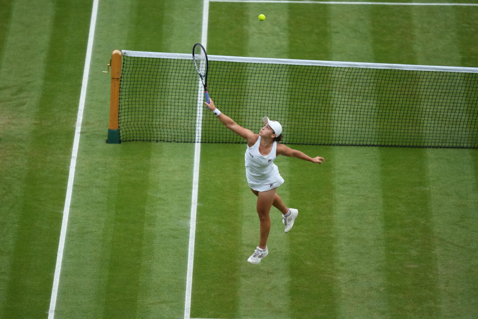 Australia's Ashleigh Barty plays a return to Czech Republic's Karolina Pliskova during the women's singles final match on day twelve of the Wimbledon Tennis Championships in London, Saturday, July 10, 2021. (Mike Hewitt/Pool Via AP)