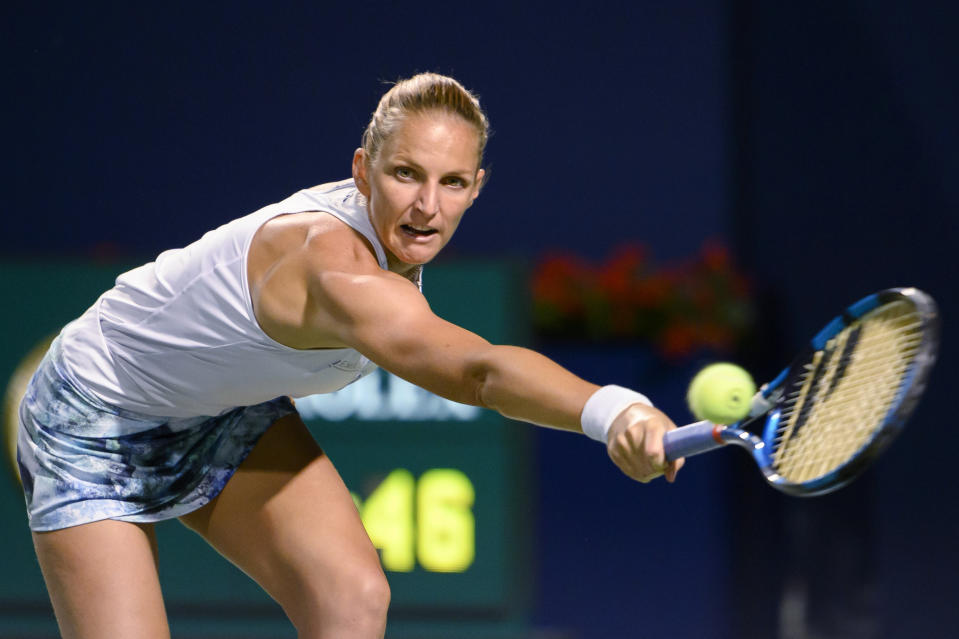 Karolina Pliskova, of the Czech Republic, reaches for a shot from Zheng Qinwen, of China, during the National Bank Open tennis tournament Friday, Aug. 12, 2022, in Toronto. (Christopher Katsarov/The Canadian Press via AP)