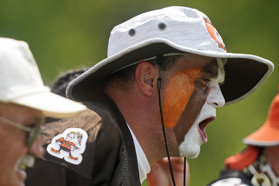 Tim "Pitdawg" Purchase cheers for the Cleveland Browns during an NFL football practice, Saturday, July 31, 2021, in Berea, Ohio. (AP Photo/Tony Dejak)
