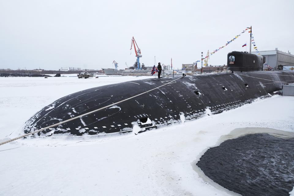 The newly-built nuclear submarine The Emperor Alexander III as seen while Russian President Vladimir Putin attends a flag-raising ceremony for newly-built nuclear submarines at the Sevmash shipyard in Severodvinsk in Russia's Archangelsk region, Monday, Dec. 11, 2023. The navy flag was raised on the Emperor Alexander III and the Krasnoyarsk submarines during Monday's ceremony. Putin has traveled to a northern shipyard to attend the commissioning of new nuclear submarines, a visit that showcases the country's nuclear might amid the fighting in Ukraine. (Mikhail Klimentyev, Sputnik, Kremlin Pool Photo via AP)