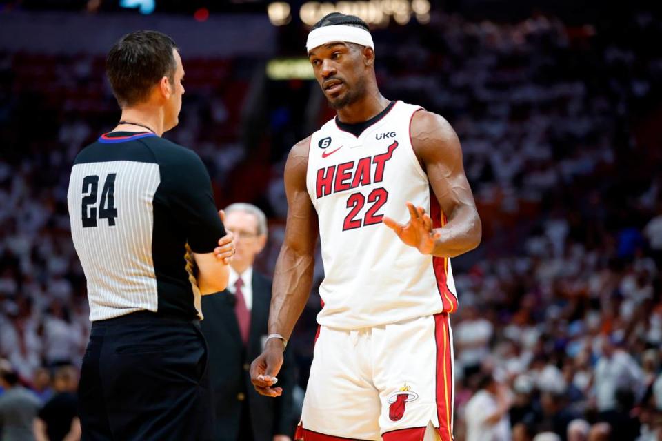 Miami Heat forward Jimmy Butler (22) speaks with game official Kevin Scott in the first quarter during the game against the New York Knicks in Game 6 of the NBA Eastern Conference Semifinals at the Kaseya Center in Miami on Friday, May 12, 2023.