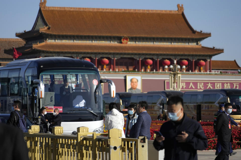 Attendees gather on Tiananmen Square ahead of the closing ceremony of the 20th National Congress of China's ruling Communist Party in Beijing, Saturday, Oct. 22, 2022. (AP Photo/Ng Han Guan)