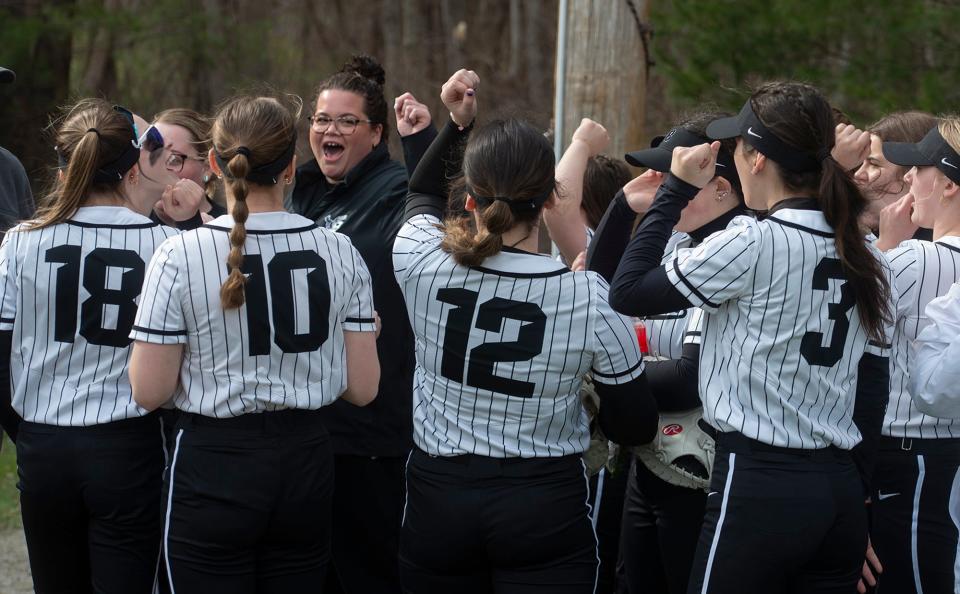 Bellingham High School varsity softball gathers with coach Courtney Parker before their home game against Millis, April 10, 2024.