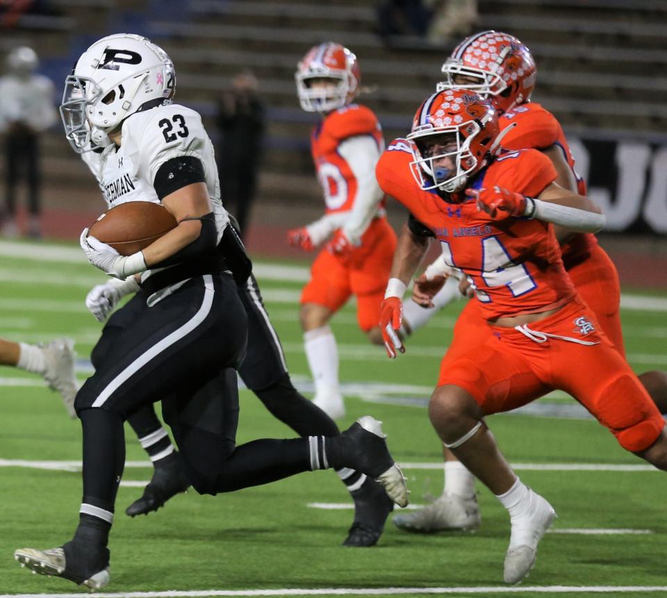 San Angelo Central High School's  Colter Farmer, right, chases after Odessa Permian running back Juzstyce Lara during a District 2-6A football game at San Angelo Stadium on Friday, Oct. 28, 2022.