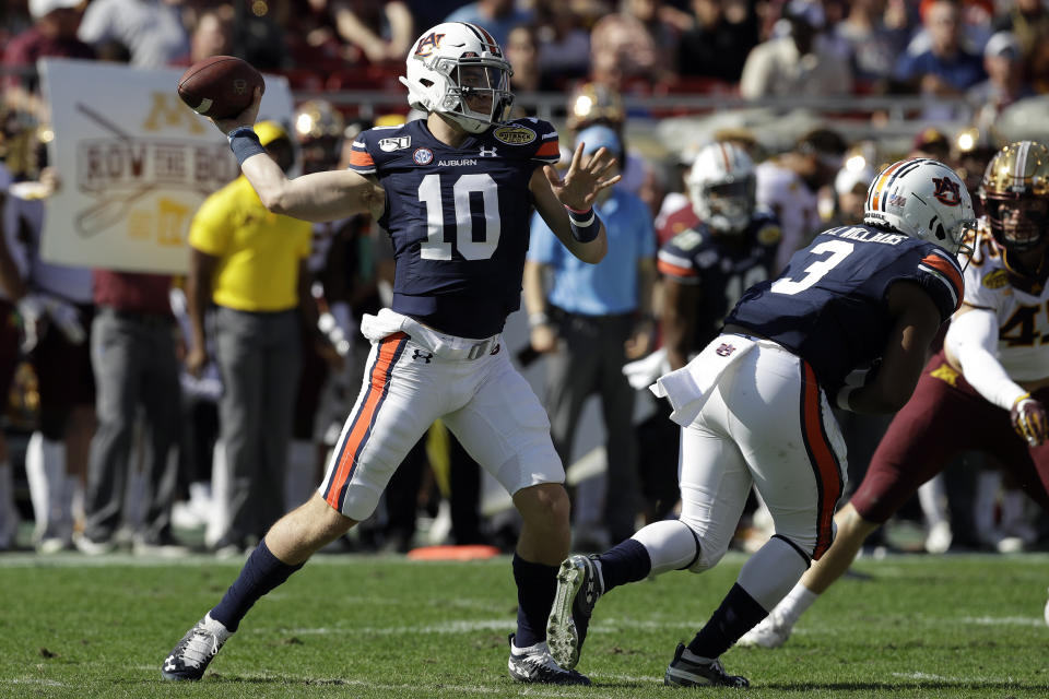 Auburn quarterback Bo Nix (10) throws a pass against Minnesota during the first half of the Outback Bowl NCAA college football game Wednesday, Jan. 1, 2020, in Tampa, Fla. (AP Photo/Chris O'Meara)