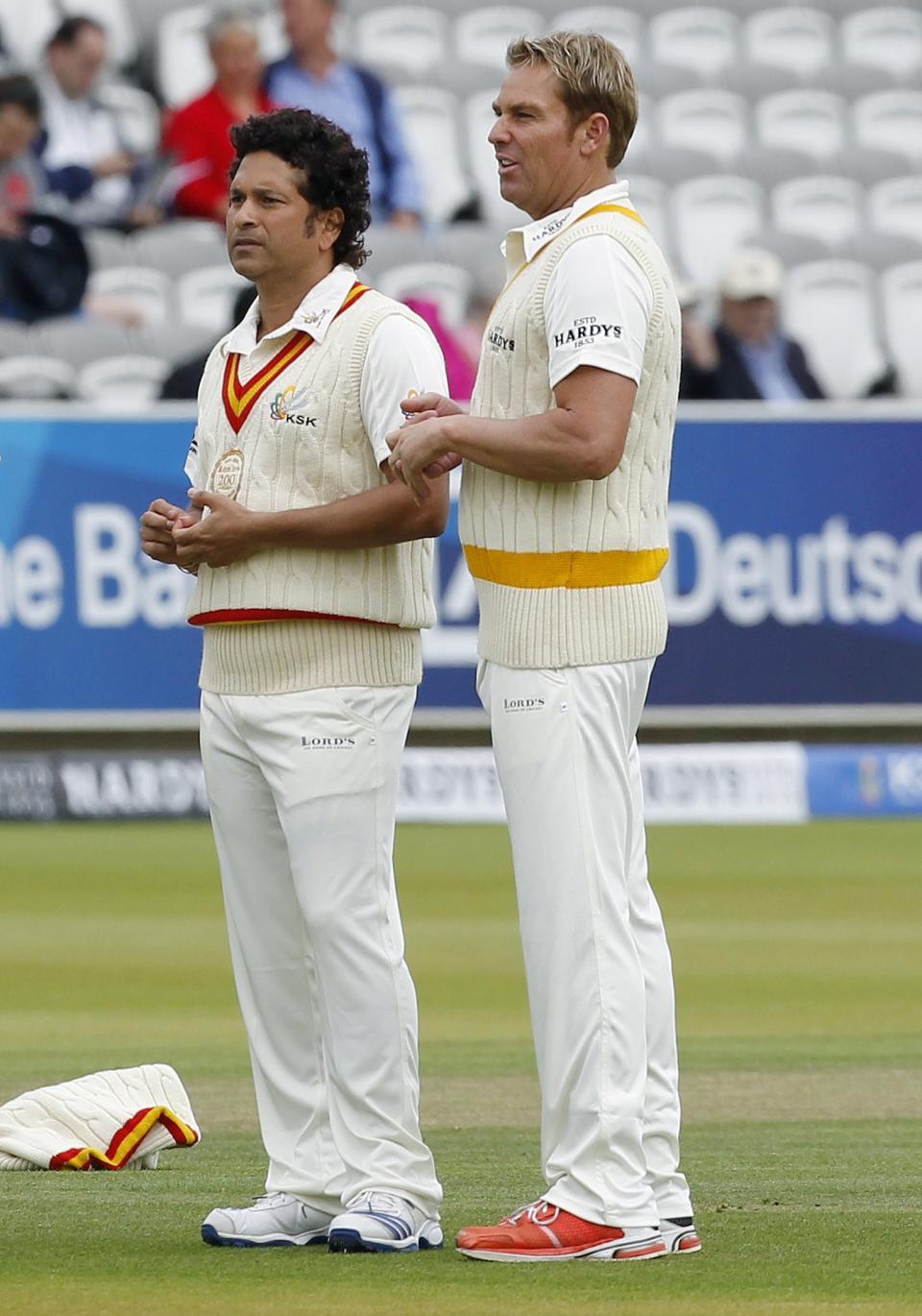 Former Indian international cricketer Sachin Tendulkar (L) talks with Shane Warne at Lords Cricket ground.