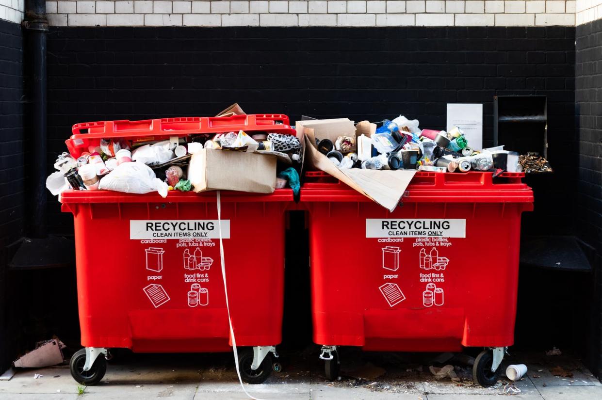 <span class="caption">When in doubt, throw it out – but not in the recycling bin. </span> <span class="attribution"><a class="link " href="https://www.gettyimages.com/detail/photo/red-recycling-bins-overflowing-with-rubbish-on-the-royalty-free-image/1347945400" rel="nofollow noopener" target="_blank" data-ylk="slk:Basak Gurbuz Derman/Moment via Getty Images;elm:context_link;itc:0;sec:content-canvas">Basak Gurbuz Derman/Moment via Getty Images</a></span>