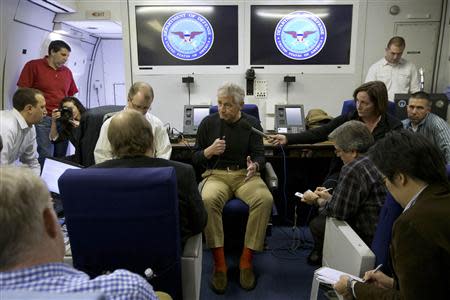 U.S. Defense Secretary Chuck Hagel speaks to the travelling press aboard a U.S. military aircraft en route to Seoul, South Korea September 28, 2013. REUTERS/Jacquelyn Martin/Pool