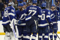 Tampa Bay Lightning goaltender Andrei Vasilevskiy (88) celebrates with teammates after the team defeated the Florida Panthers in Game 4 of an NHL hockey Stanley Cup first-round playoff series, Saturday, April 27, 2024, in Tampa, Fla. (AP Photo/Chris O'Meara)