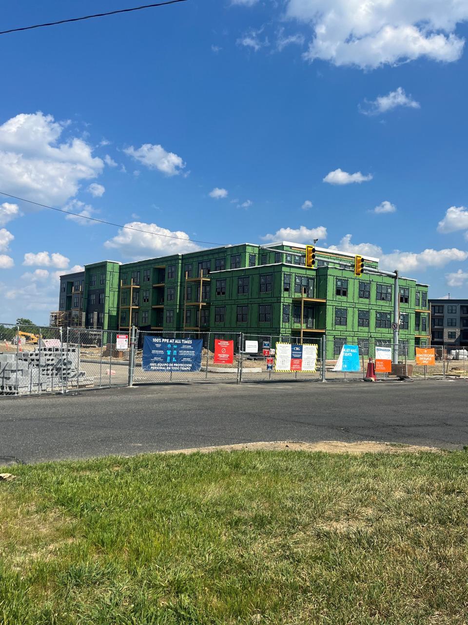 Construction underway at Atlee Square apartment complex.