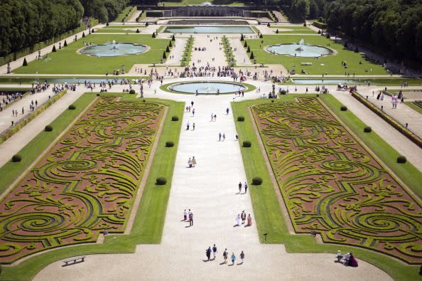 <p>Nicolas Fouquet, the superintendent of finances of Louis XIV, called upon three of the country’s most renowned artisans to develop a château and garden the embodied French grandeur. Together, architect Louis Le Vau, landscape architect André le Nôtre, and painter-decorator Charles Le Brun worked to build the architectural jewel of the 17th-century, marking the beginning of the “Louis XIV style” where structures and gardens were built on a visual axis. </p><p>In particular, the formal gardens feature symmetrical, strong lines with flowers and boxwoods laid out in arabesques. There’s also a number of surprises throughout the property including a Grand Canal hidden from the château’s view. </p>