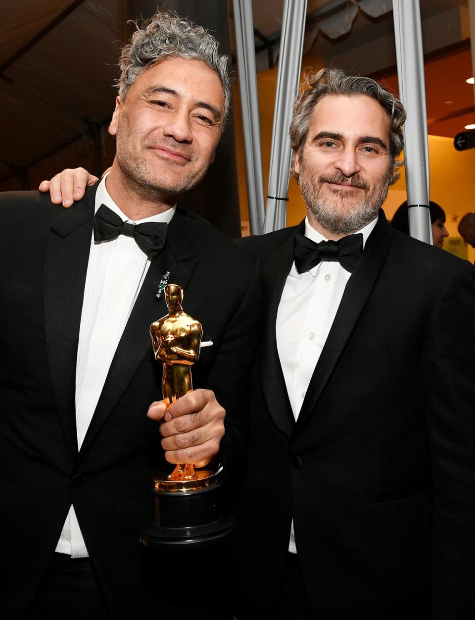 Taika Waititi and Joaquin Phoenix bond over being Academy Award winners at the 92nd Annual Academy Awards Governors Ball.