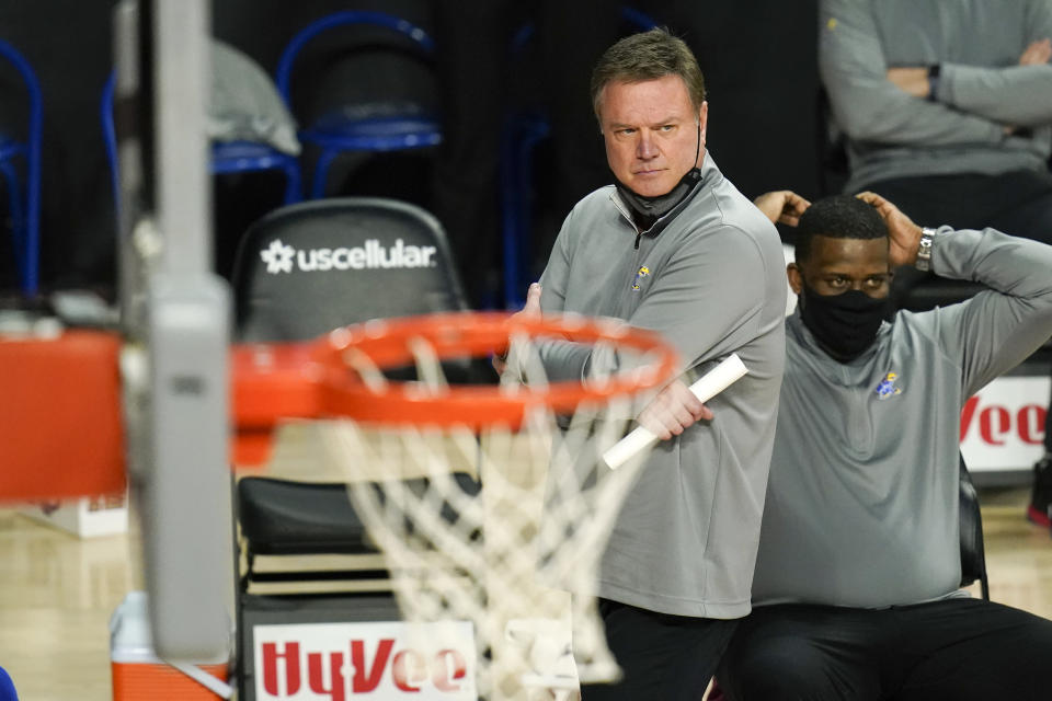 Kansas head coach Bill Self watches from the bench during the second half of an NCAA college basketball game against Iowa State, Saturday, Feb. 13, 2021, in Ames, Iowa. Kansas won 64-50. (AP Photo/Charlie Neibergall)