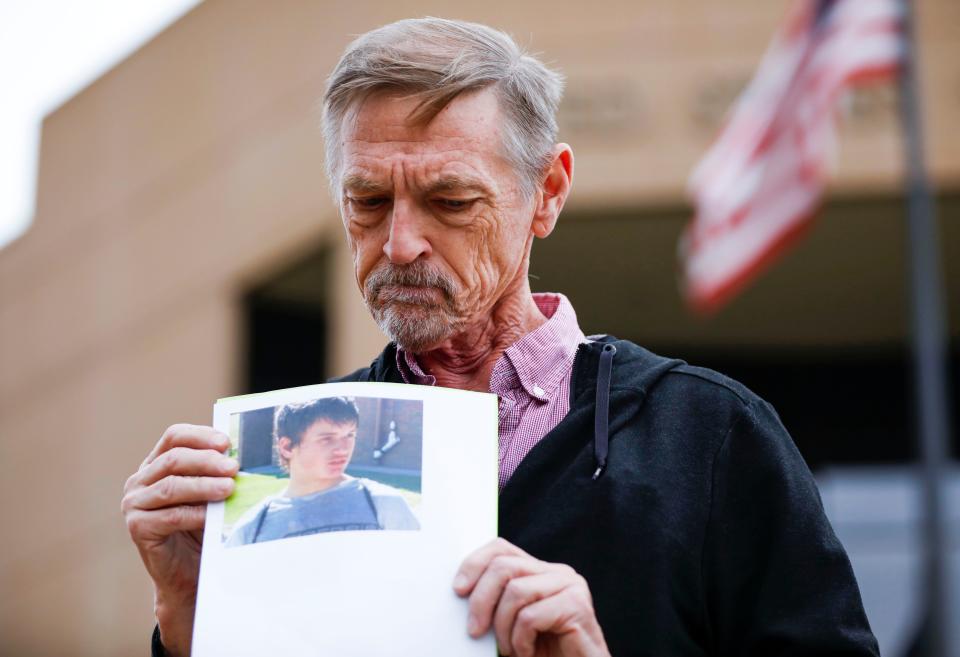 David Clohessy, the former national director of SNAP (Survivors Network of those Abused by Priests), holds a photo of the late Jason Britt outside the U.S. federal courthouse in Springfield on Tuesday, Oct. 24, 2023. Britt died last year of multiple organ failure at age 29, more than a decade after attending Agape Boarding School.