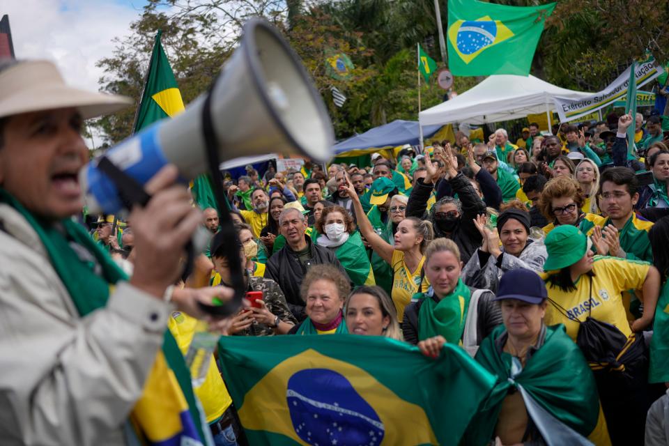 Supporters of outgoing President Jair Bolsonaro protest against his defeat in the country's presidential runoff, outside a military base in Sao Paulo, Brazil, Thursday, Nov. 3, 2022. Some supporters are calling on the military to keep Bolsonaro in power, even as his administration signaled a willingness to hand over the reins to his rival, President-elect Luiz Inacio Lula da Silva.