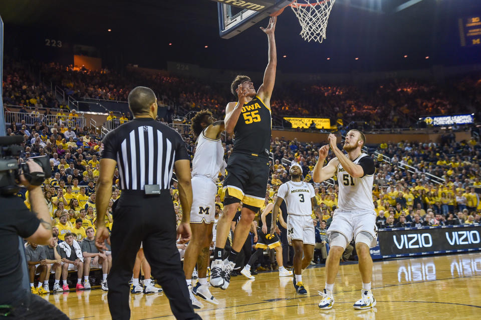 ANN ARBOR, MICHIGAN - DECEMBER 6: Luke Garza #55 of the Iowa Hawkeyes scores a basket during the first half of a college basketball game against the Michigan Wolverines at Crisler Arena on December 6, 2019 in Ann Arbor, Michigan.  Garza scored a game high 44 points in the loss to the Michigan Wolverines 91-103.  (Photo by Aaron J. Thornton/Getty Images)