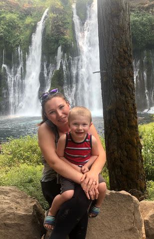 <p>Courtesy of Kelly Mulholland</p> Kelly Mulholland and her son pictured by a waterfall