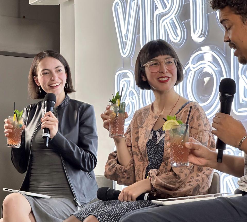 Book of the Month’s Brianna Goodman and Jerrod MacFarlane with author Kaliane Bradley, center, and the “Ministry of Time”-themed cocktail at a recording of the Virtual Book Tour podcast.