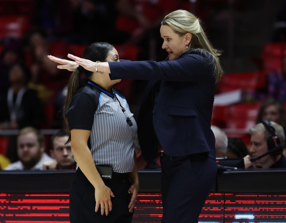 Utah women’s basketball coach coach Lynne Roberts tries to make a point with a referee as the Utes host 14th-ranked Arizona.