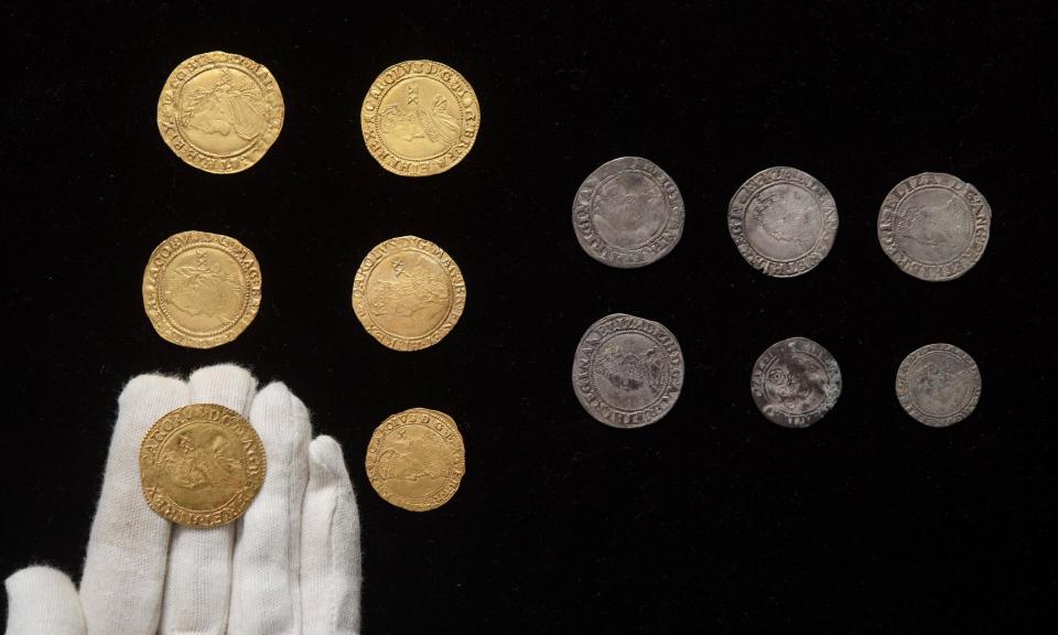 <span>The treasure contains James I and Charles I gold coins, silver half crowns, shillings and sixpences; and Elizabeth I and Phillip and Mary silver shillings and sixpences.</span><span>Photograph: ZacharyCulpin/BNPS</span>